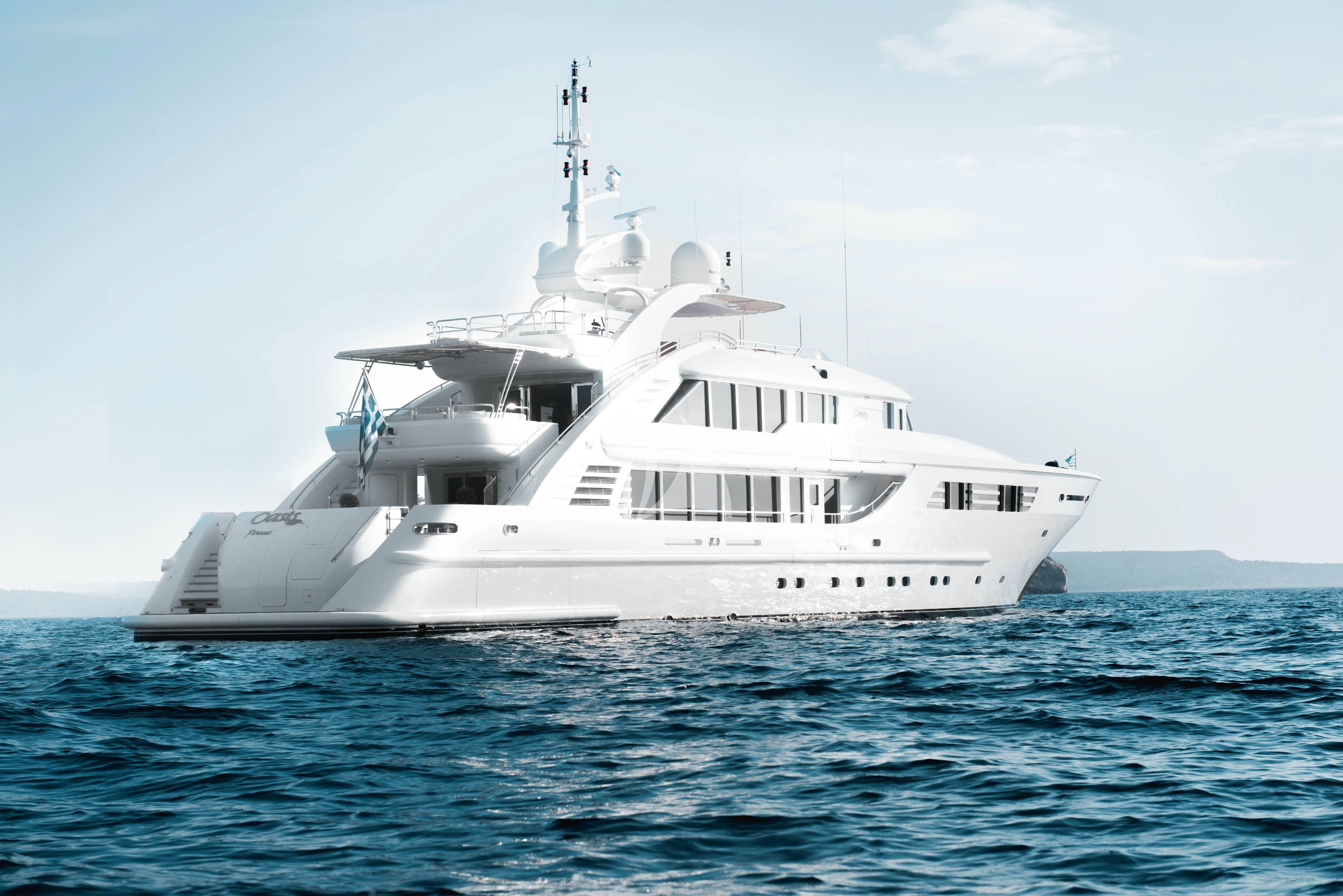 a white yacht in the water aboard OASIS Yacht for Sale