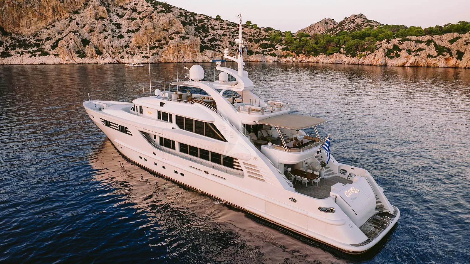 a white yacht on the water aboard OASIS Yacht for Sale
