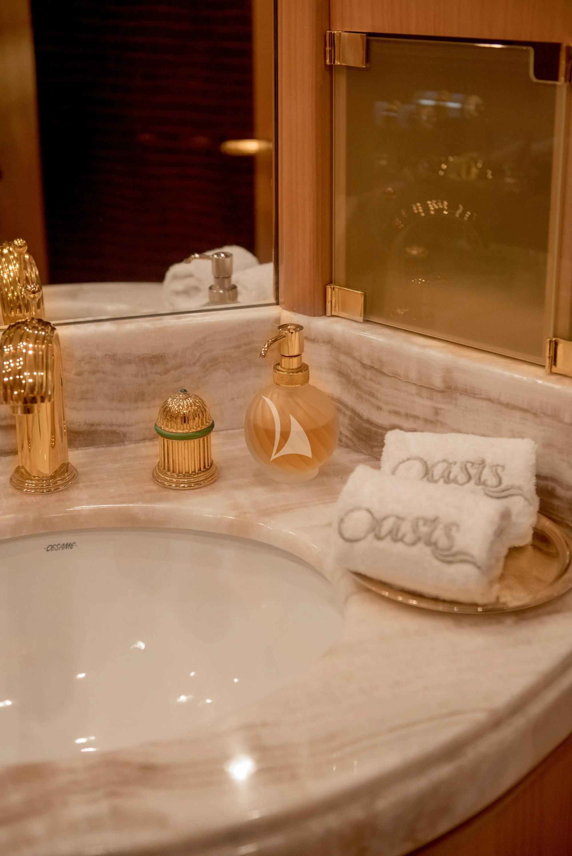 a bathroom sink with towels aboard OASIS Yacht for Sale