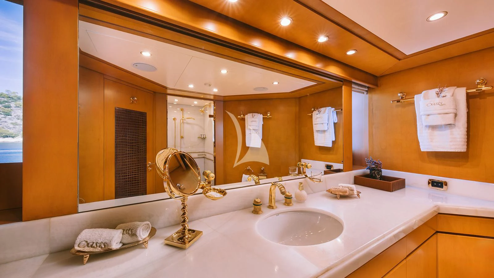 a bathroom with a large mirror aboard OASIS Yacht for Sale