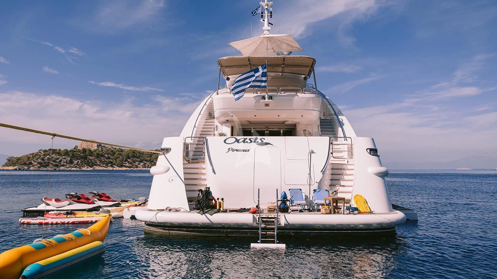 a large white boat in the water aboard OASIS Yacht for Sale