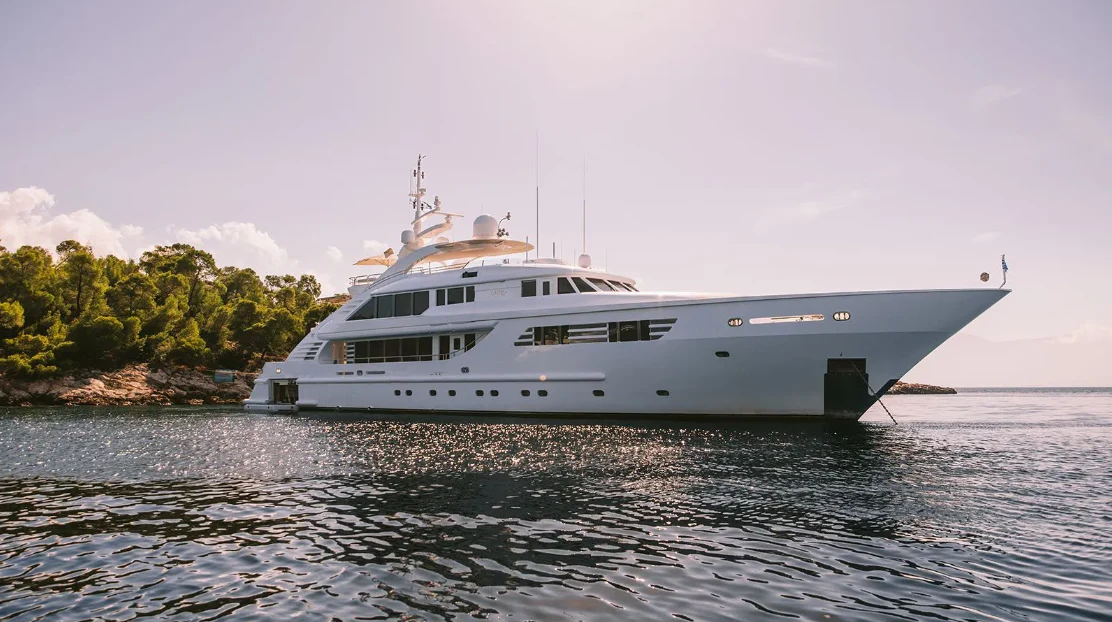 a white boat on water aboard OASIS Yacht for Sale