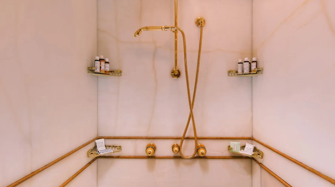 a gold cross on a stand aboard OASIS Yacht for Sale