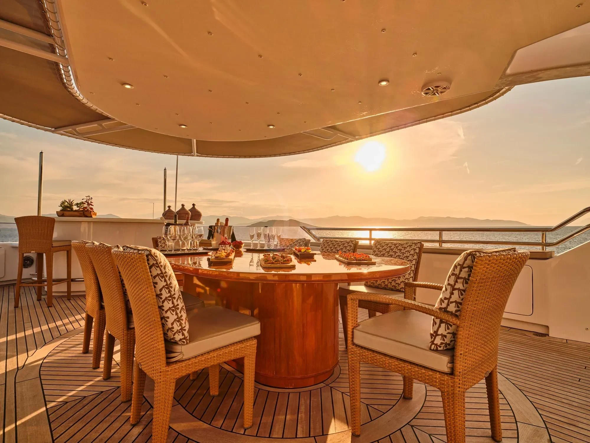 a dining table and chairs in a tent aboard OASIS Yacht for Sale