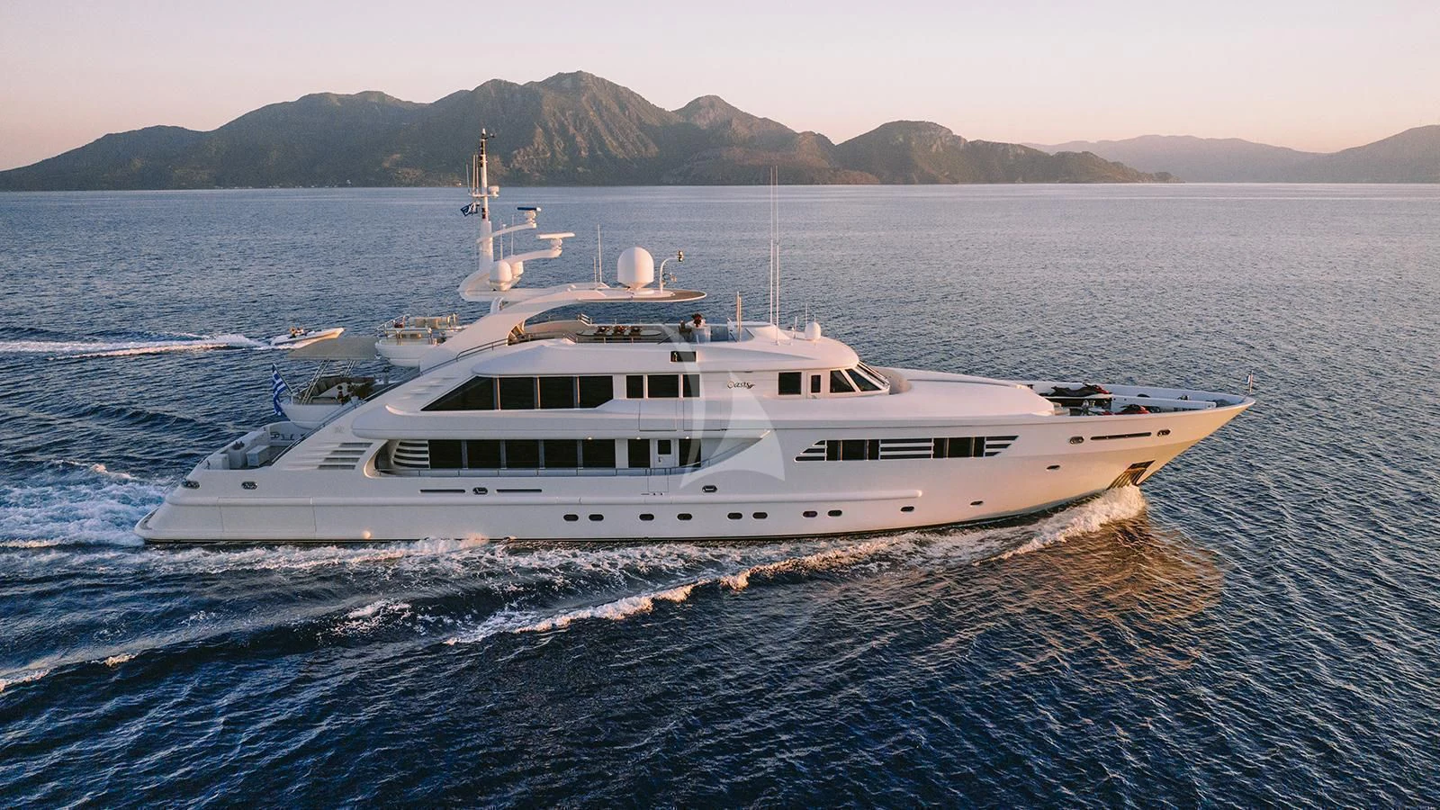 a white yacht on the water aboard OASIS Yacht for Sale