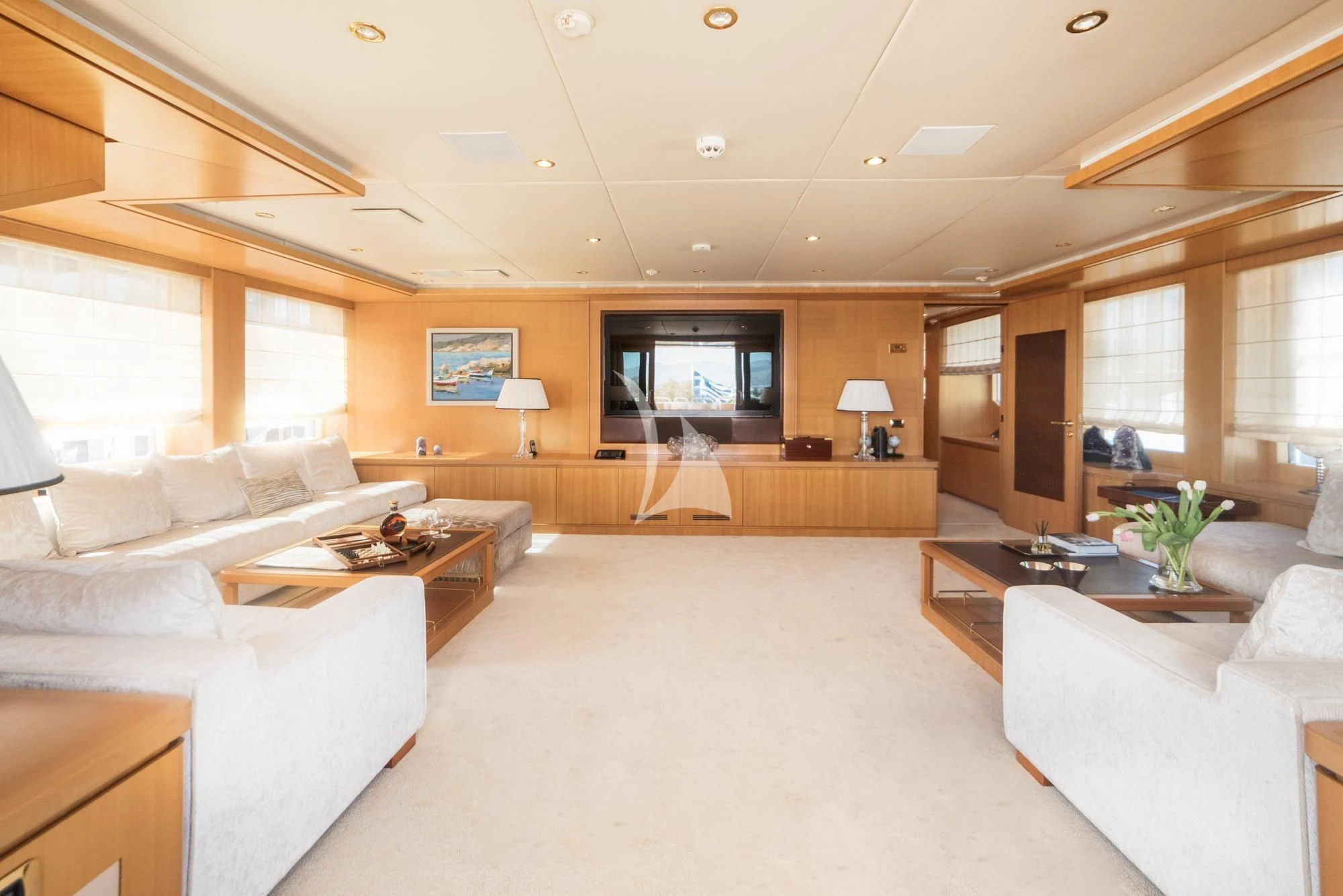a living room with a large window aboard OASIS Yacht for Sale