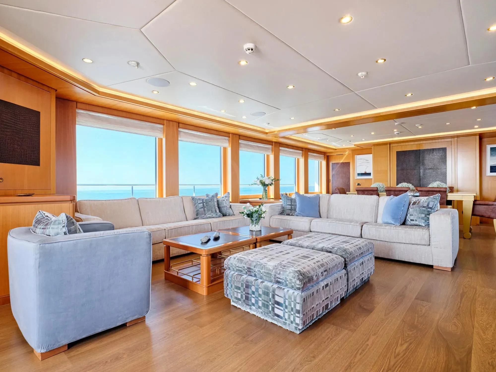 a living room with a couch and a coffee table aboard OASIS Yacht for Sale