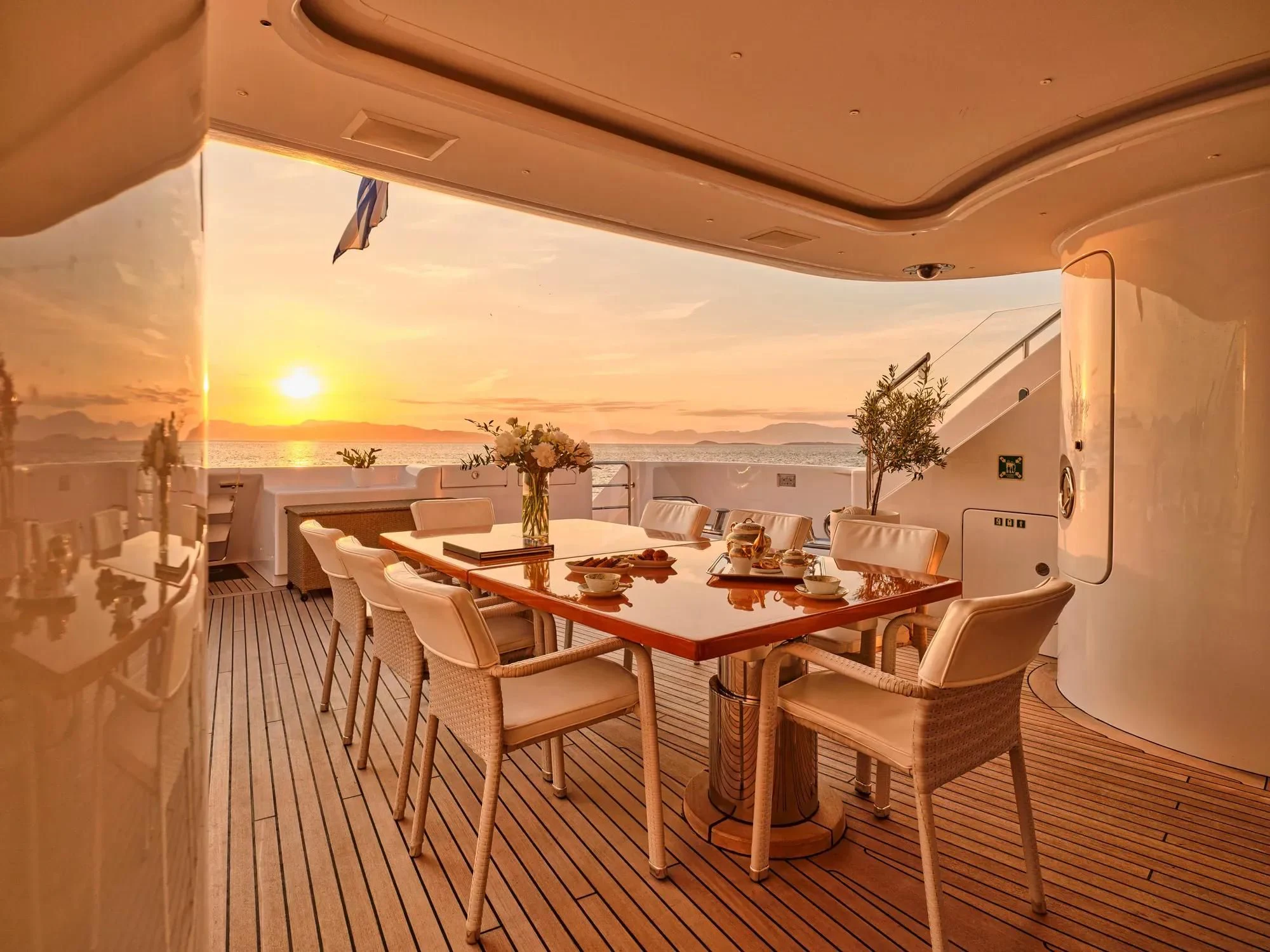 a dining room with tables and chairs aboard OASIS Yacht for Sale