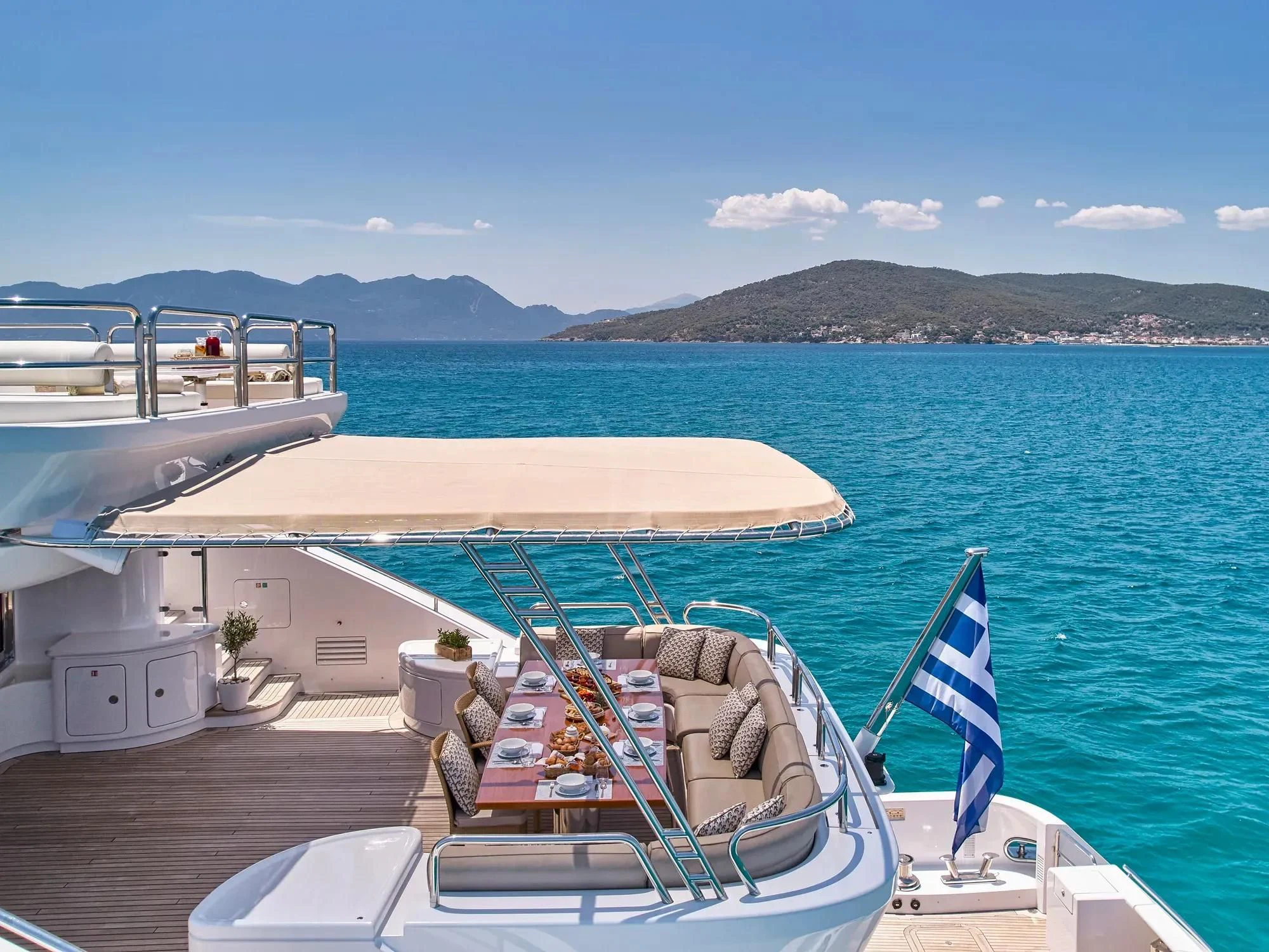 a boat docked at a pier aboard OASIS Yacht for Sale
