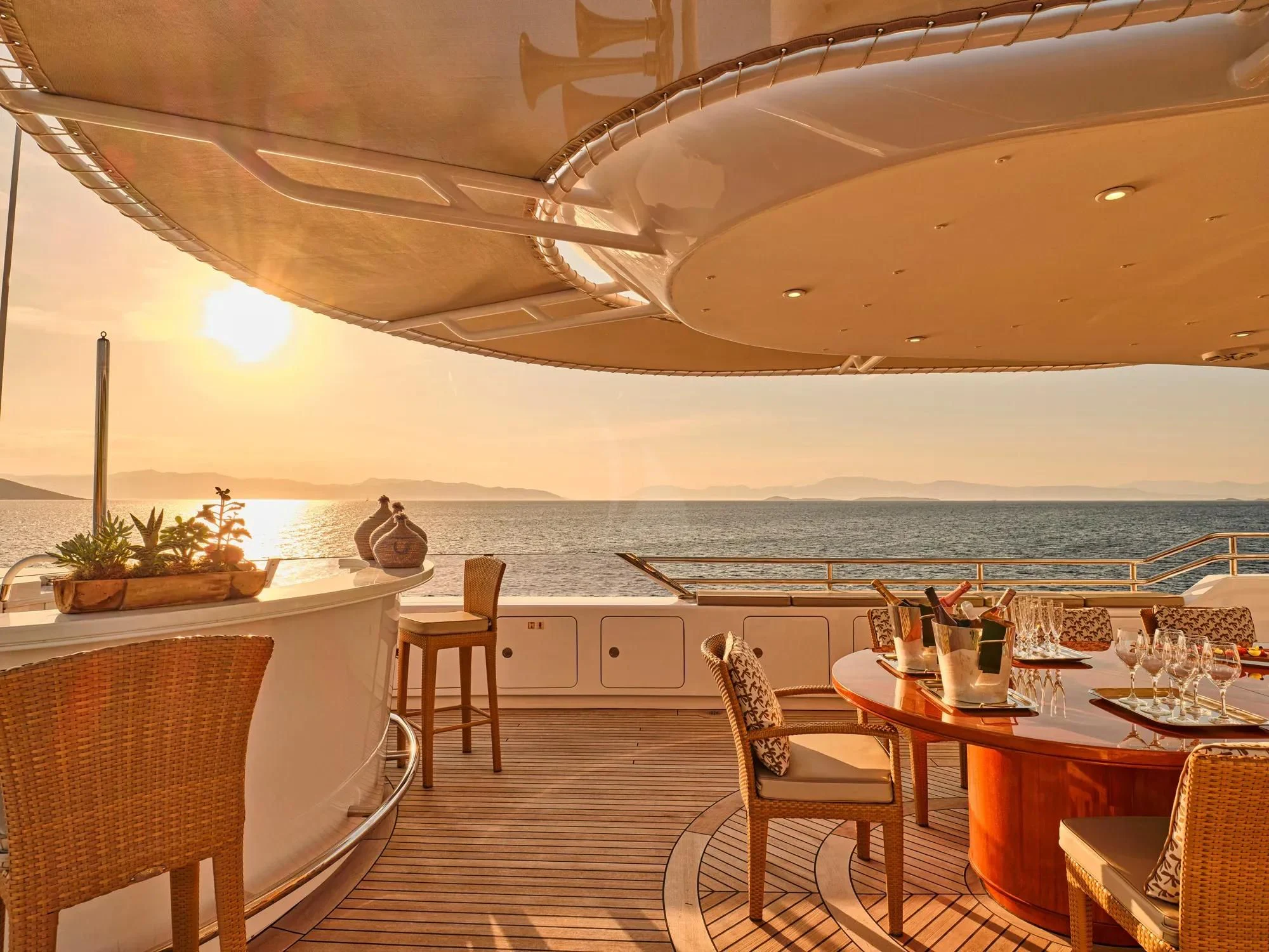 a room with a table and chairs aboard OASIS Yacht for Sale