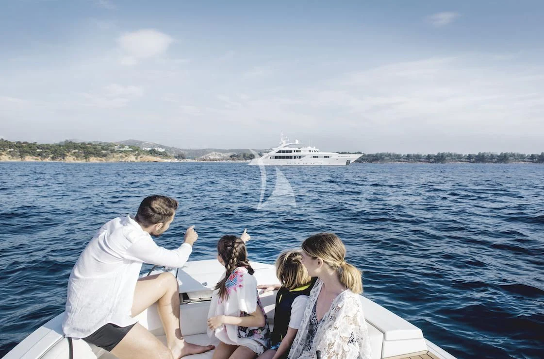a family on a boat aboard OASIS Yacht for Sale