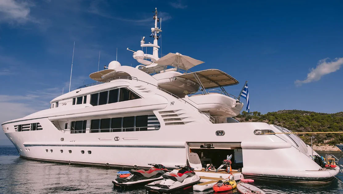 a boat docked at a pier aboard OASIS Yacht for Sale
