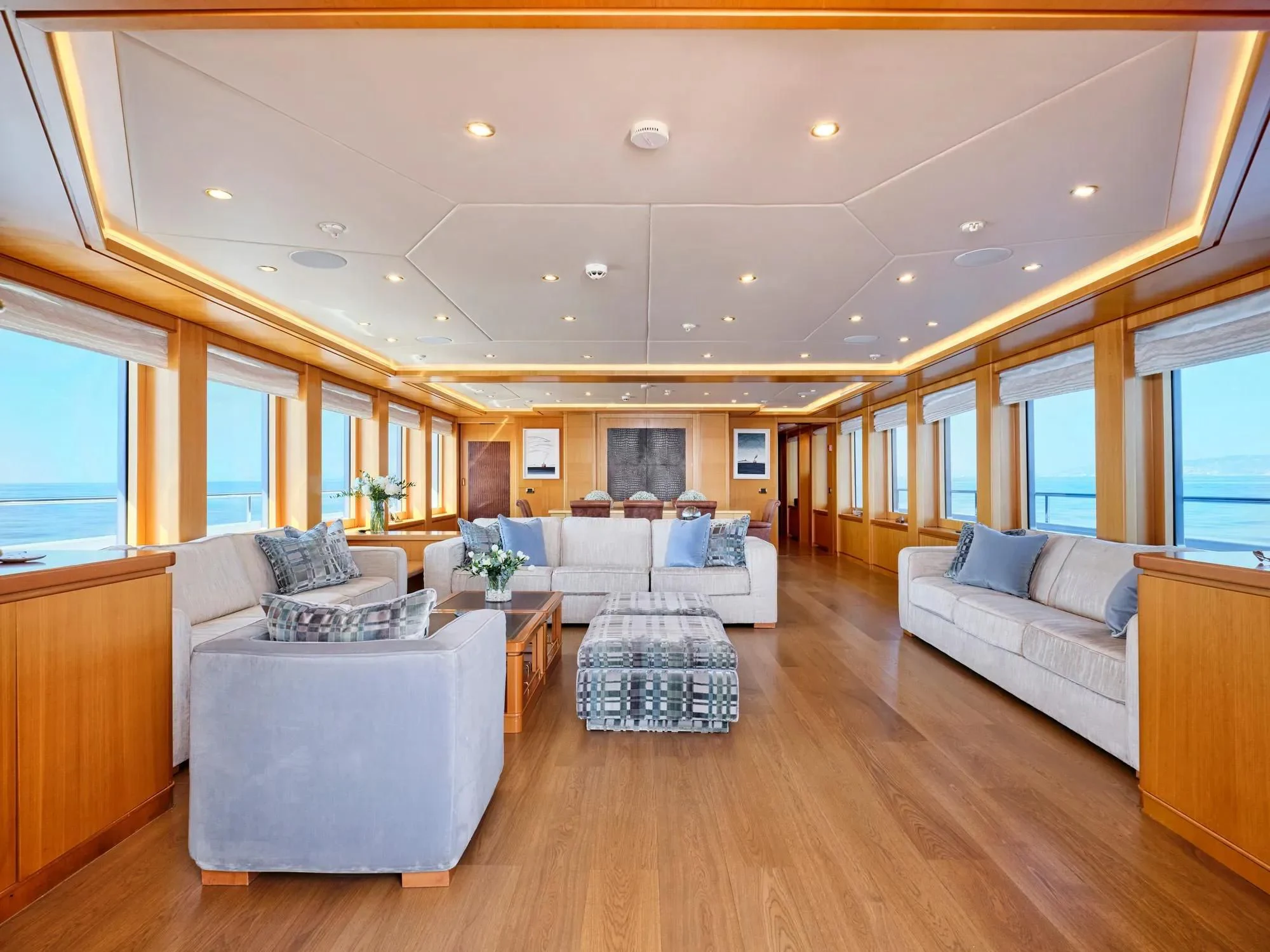 a living room with a large window aboard OASIS Yacht for Sale