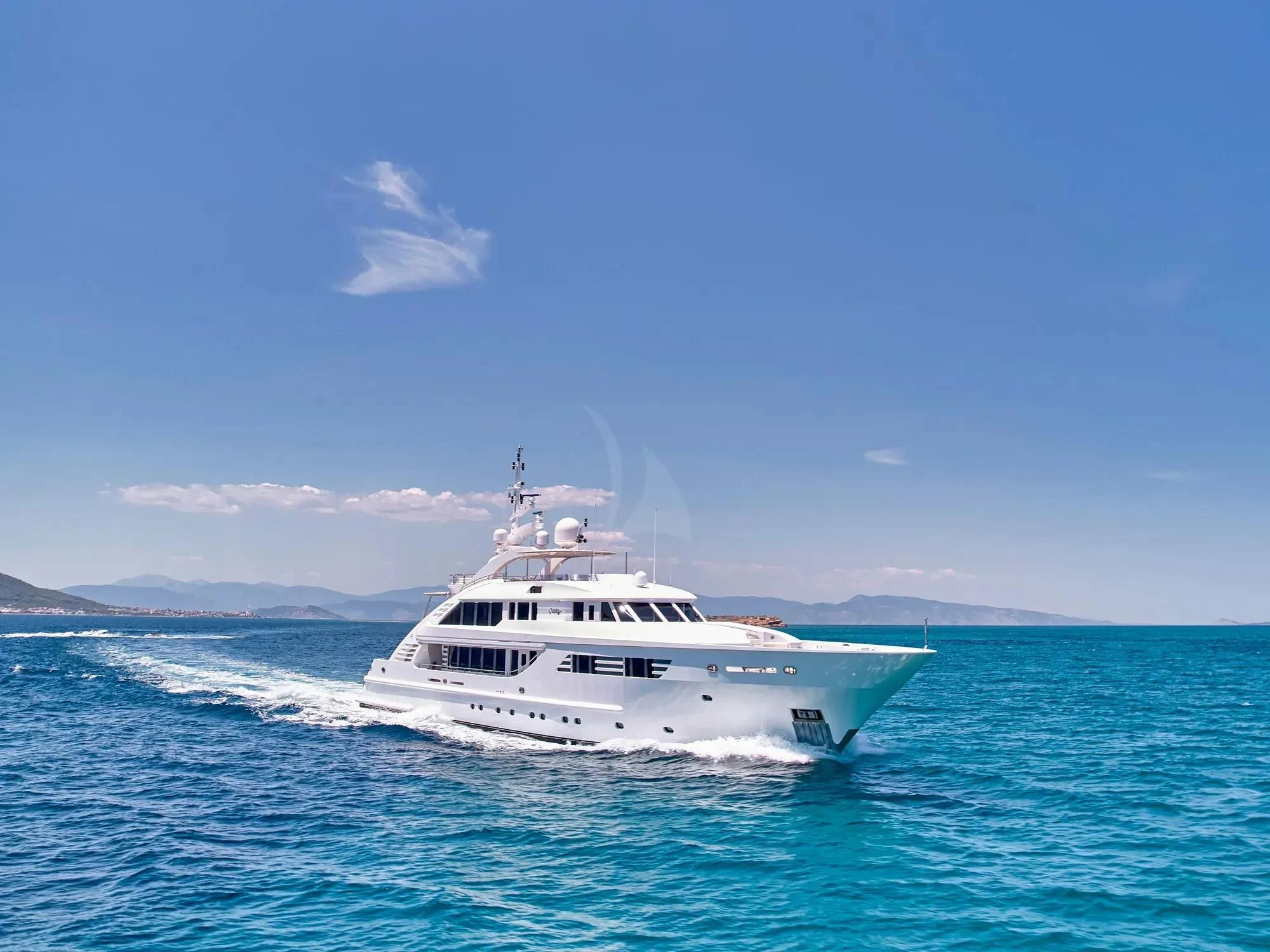 a white boat in the water aboard OASIS Yacht for Sale