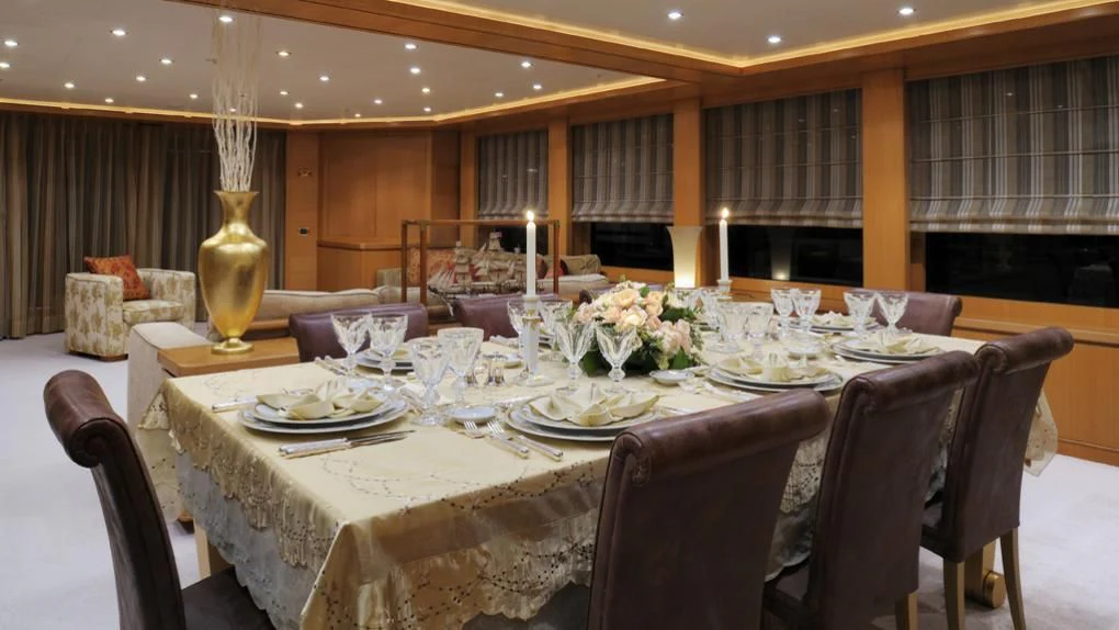 a table set for a dinner aboard OASIS Yacht for Sale