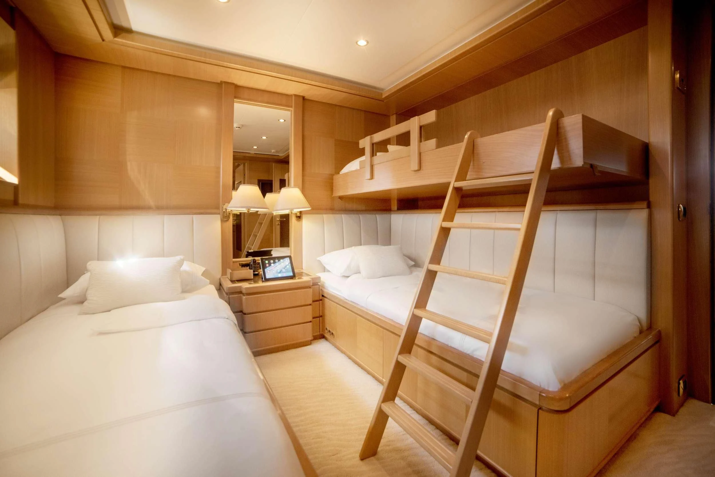 a room with two beds aboard OASIS Yacht for Sale