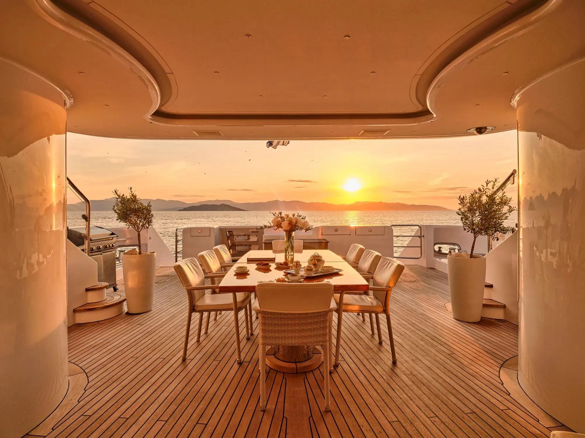 a large room with tables and chairs aboard OASIS Yacht for Sale