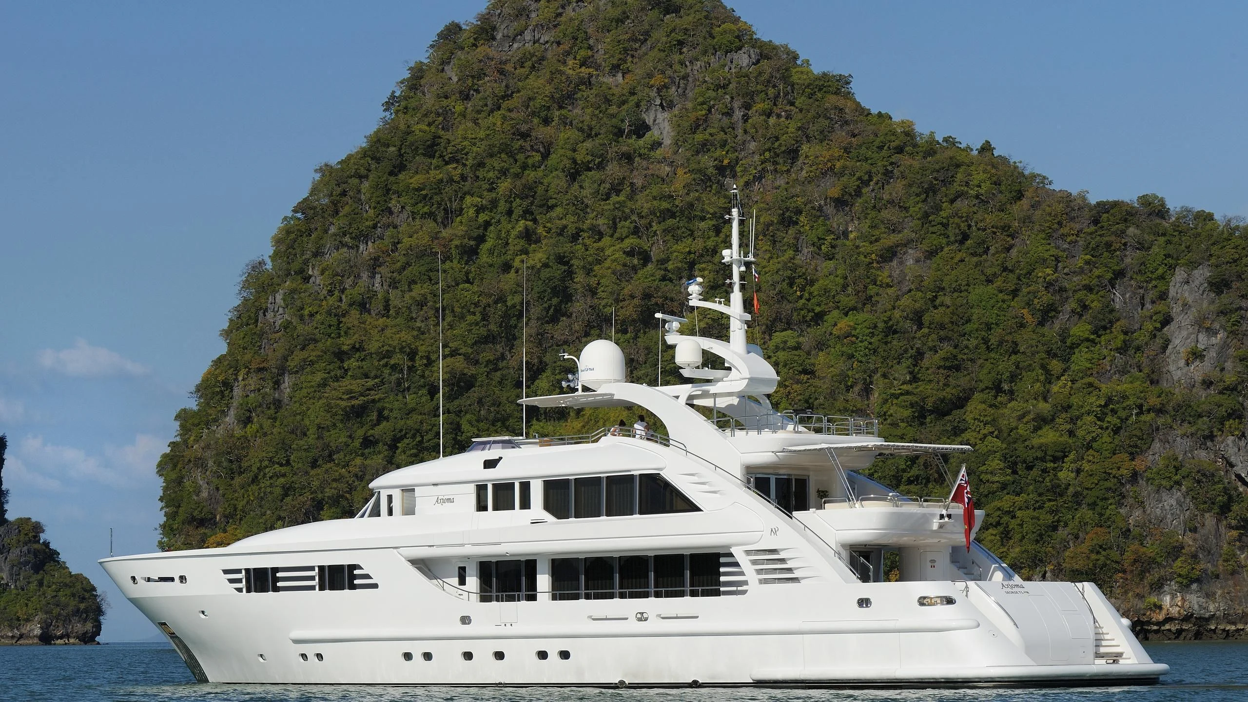 a white boat in the water aboard OASIS Yacht for Sale