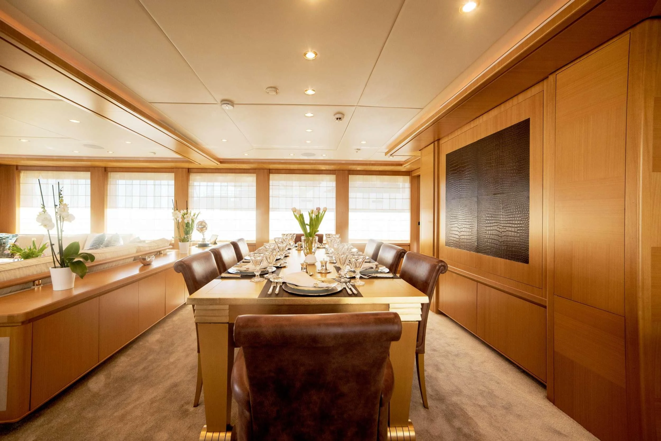 a kitchen with a dining table aboard OASIS Yacht for Sale