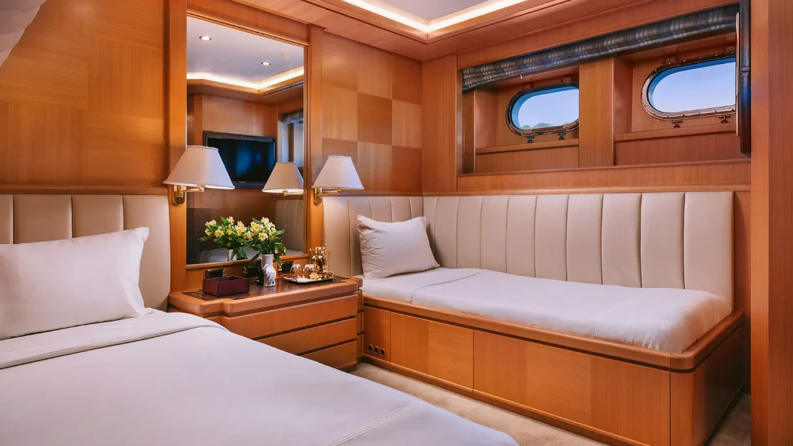 a room with two beds aboard OASIS Yacht for Sale