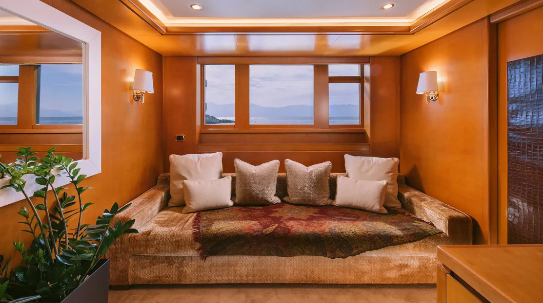 a bed with pillows aboard OASIS Yacht for Sale