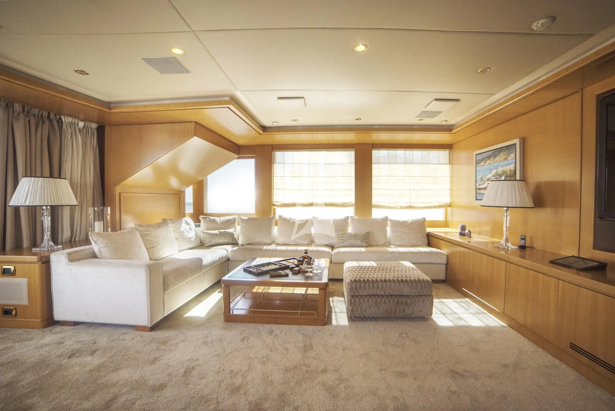 a large living room with a large window aboard OASIS Yacht for Sale
