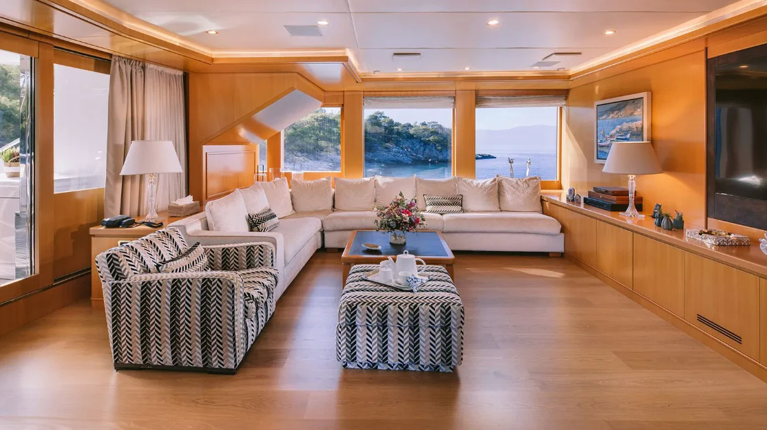 a living room with a large window aboard OASIS Yacht for Sale