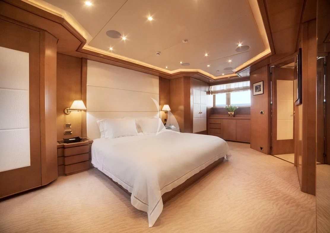 a large bedroom with a large bed aboard OASIS Yacht for Sale