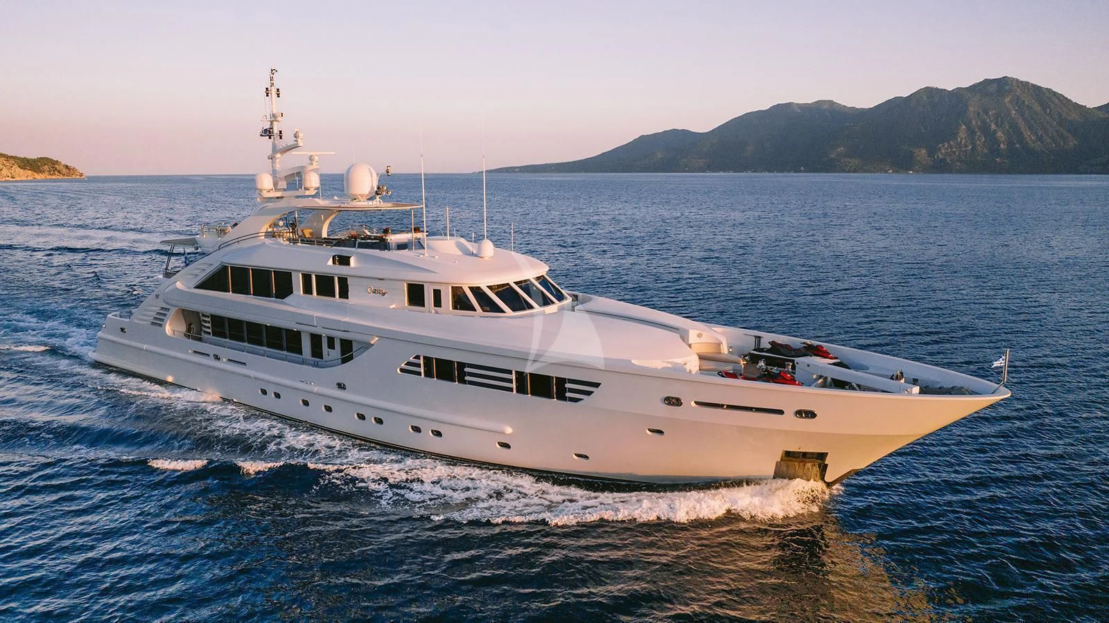a large white boat in the water aboard OASIS Yacht for Sale