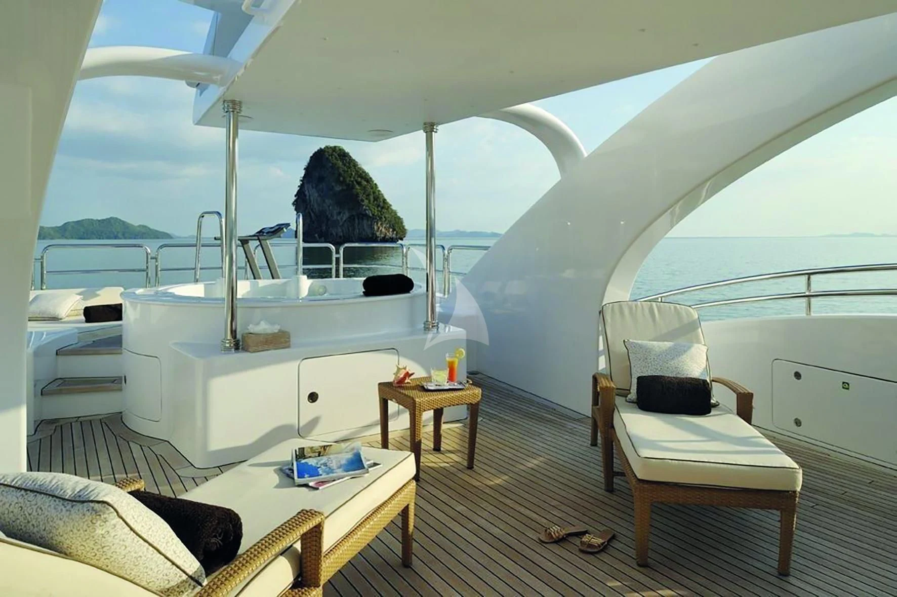 a room with a bed and a chair aboard OASIS Yacht for Sale