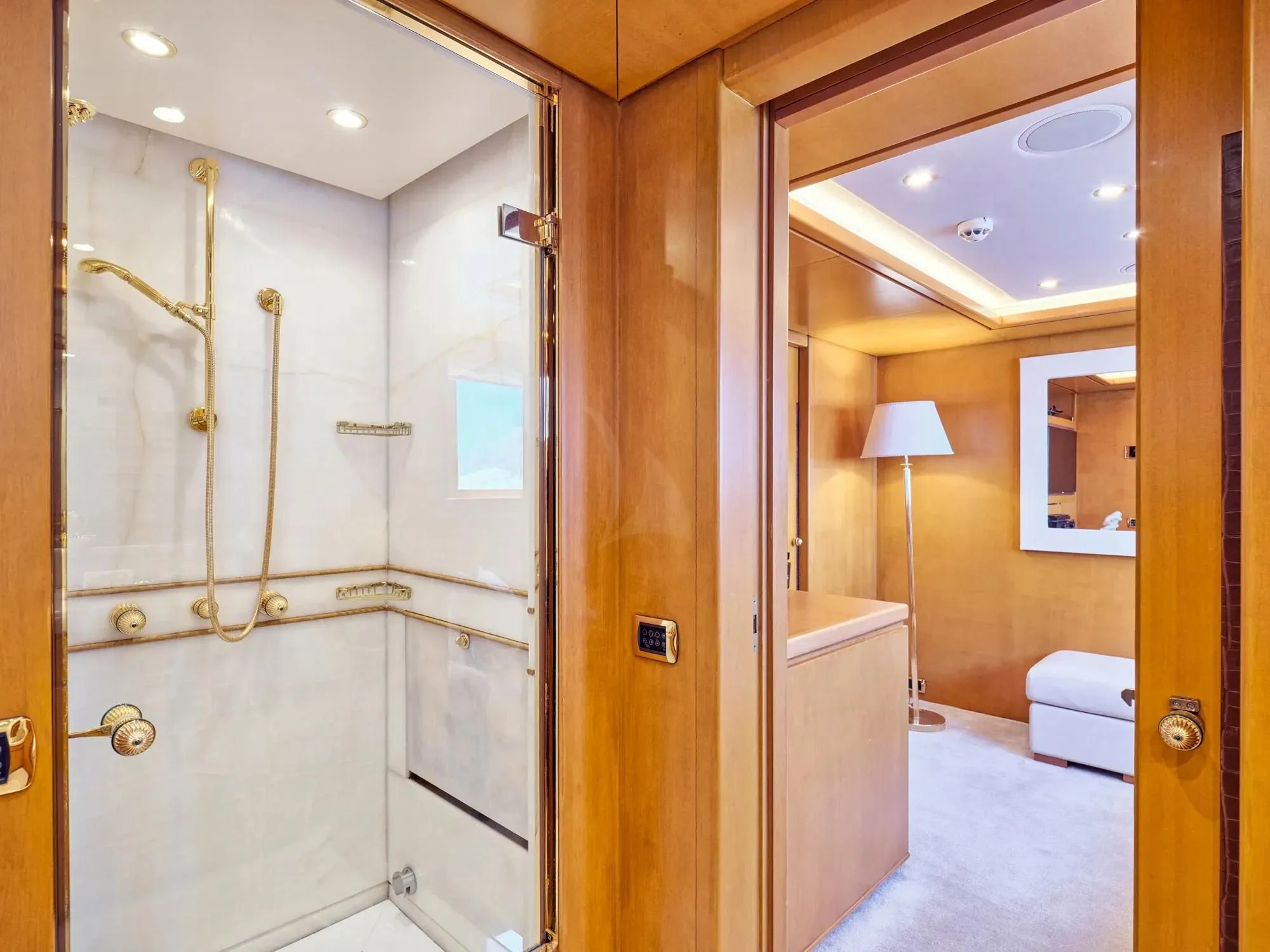 a bathroom with a glass shower aboard OASIS Yacht for Sale