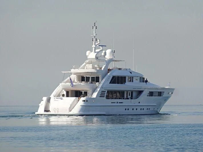a large white boat in the water aboard OASIS Yacht for Sale