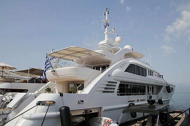 a boat docked at a pier aboard OASIS Yacht for Sale