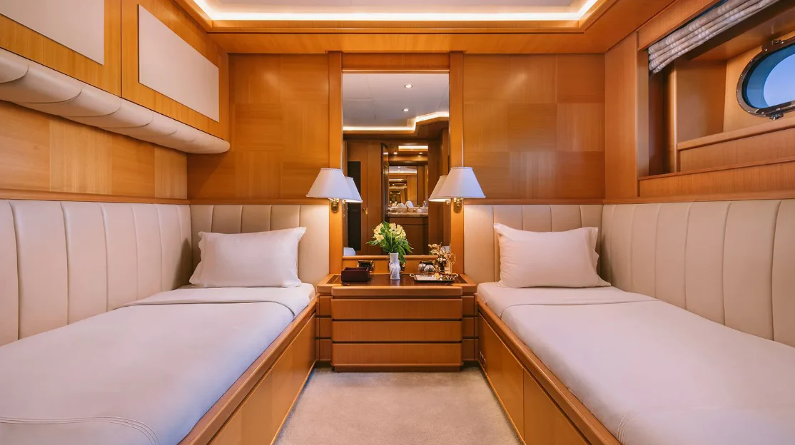a room with two beds aboard OASIS Yacht for Sale