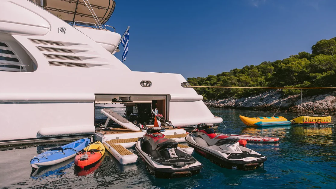 boats docked at a pier aboard OASIS Yacht for Sale