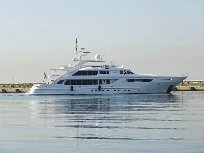 a white boat on the water aboard OASIS Yacht for Sale
