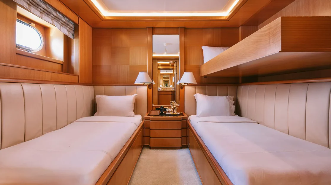a room with two beds aboard OASIS Yacht for Sale