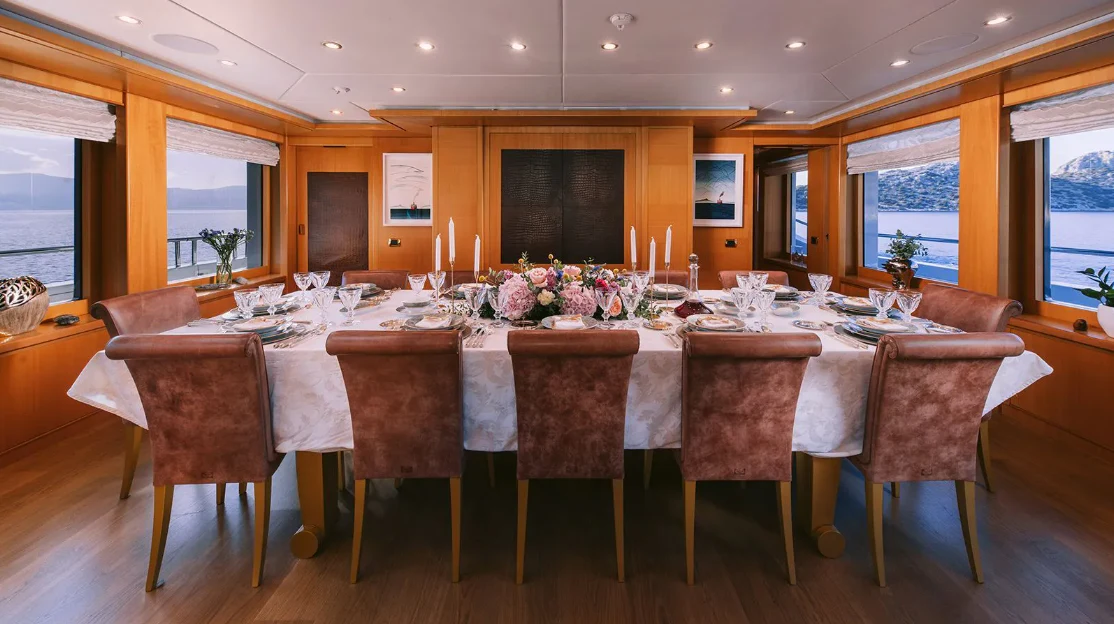 a table with a cloth draped over it aboard OASIS Yacht for Sale
