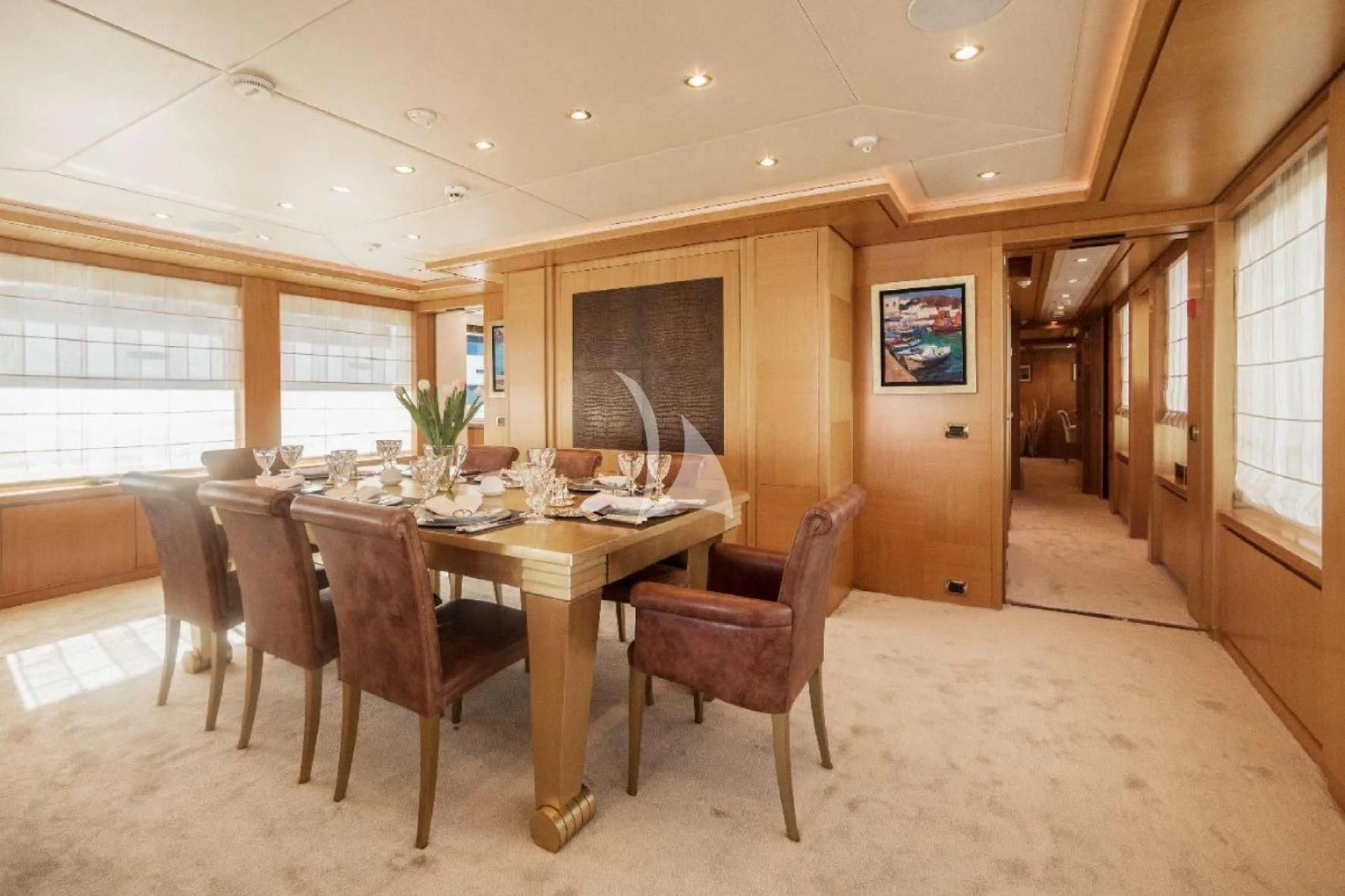 a dining room with a table aboard OASIS Yacht for Sale