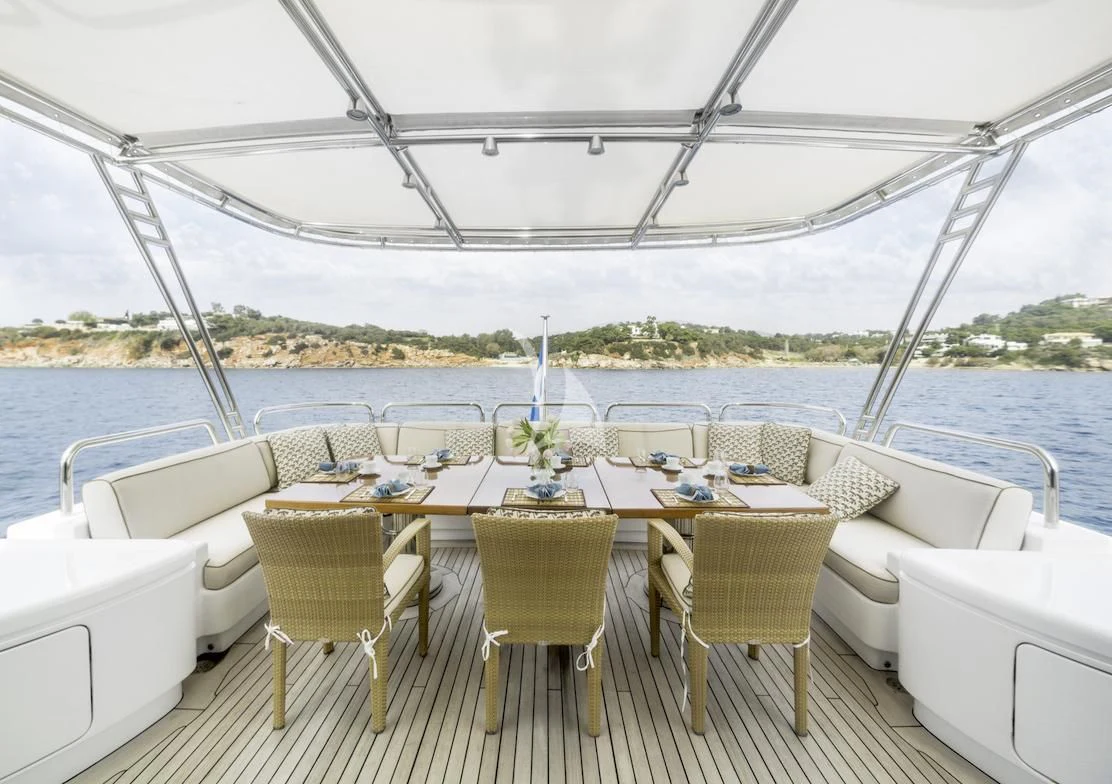 a table set for a dinner aboard OASIS Yacht for Sale