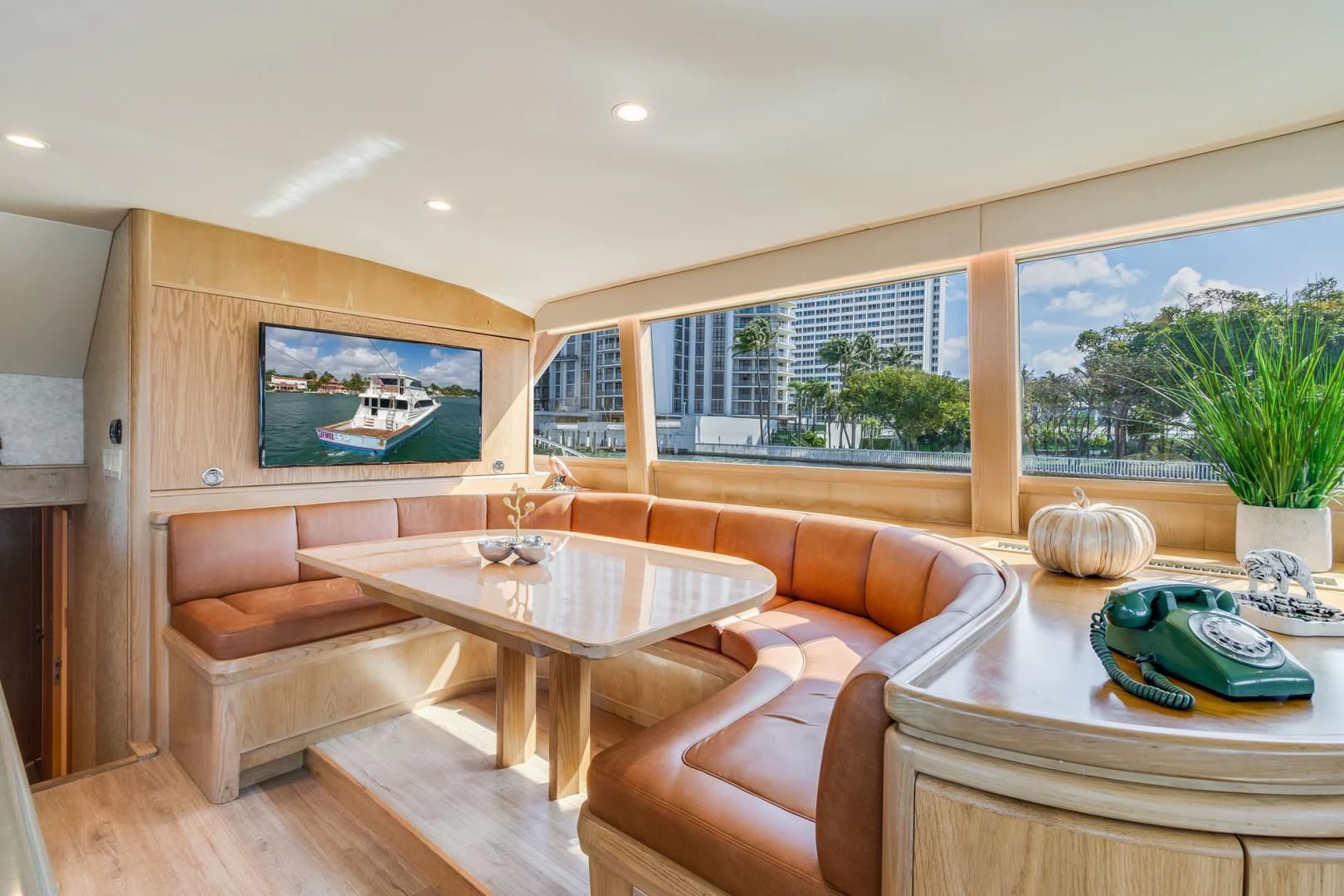 a living room with a table and couches aboard JEWEL OF THE NILE Yacht for Sale