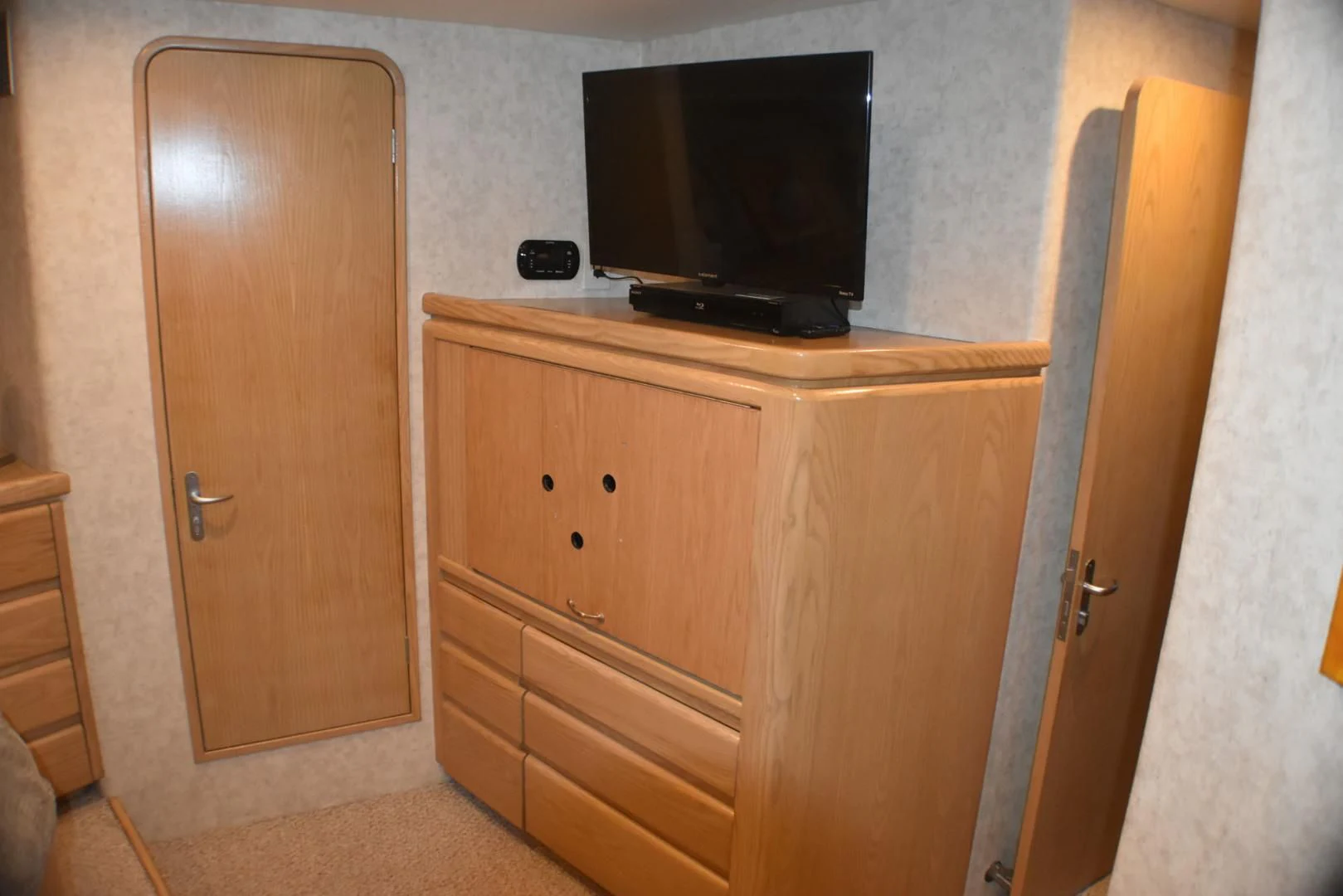 a tv on a cabinet aboard JEWEL OF THE NILE Yacht for Sale