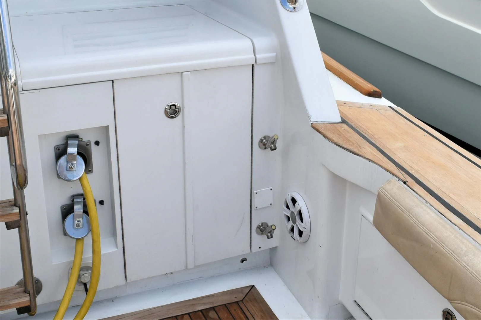a white cabinet with a wooden handle aboard JEWEL OF THE NILE Yacht for Sale