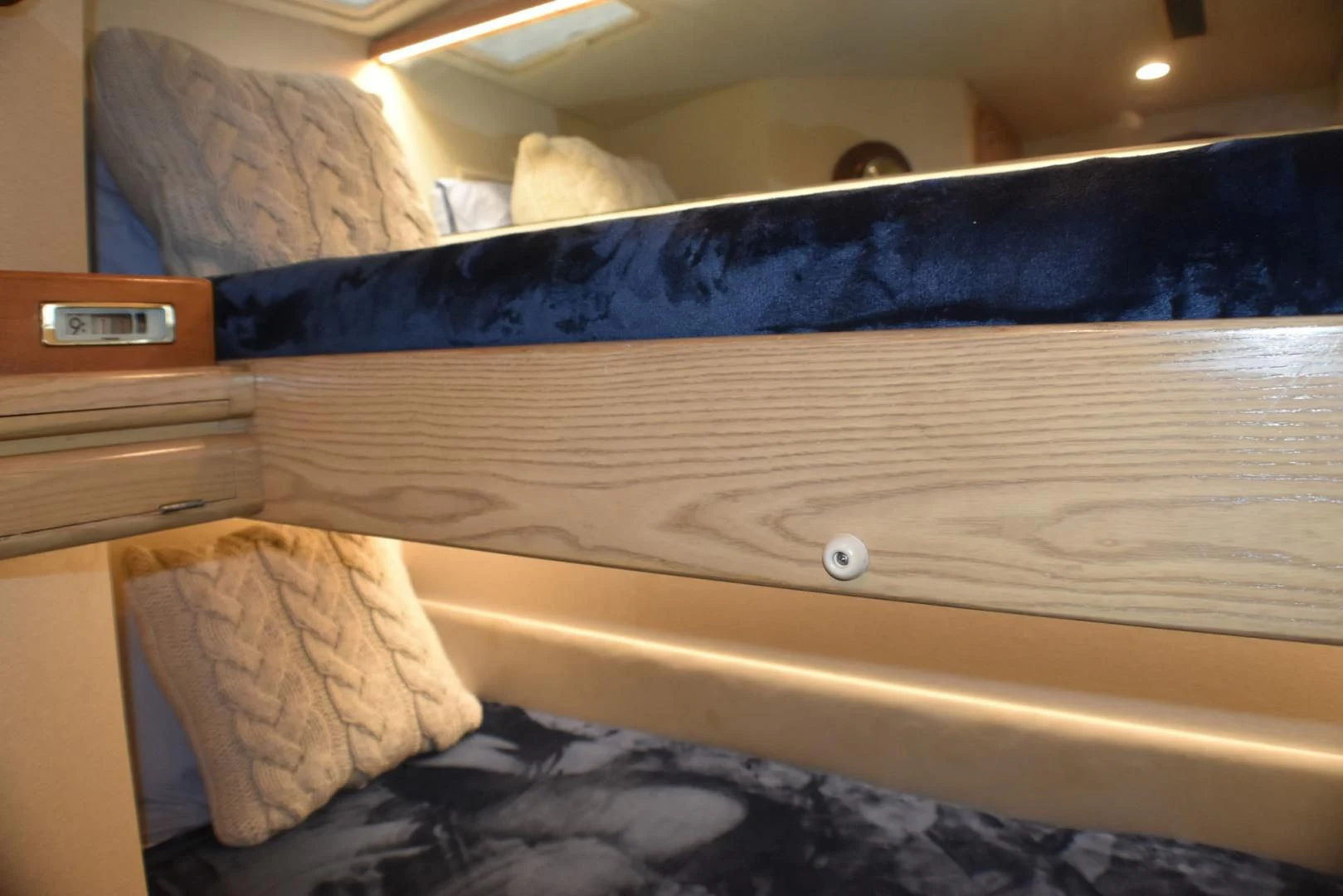 a bed with a wooden frame aboard JEWEL OF THE NILE Yacht for Sale