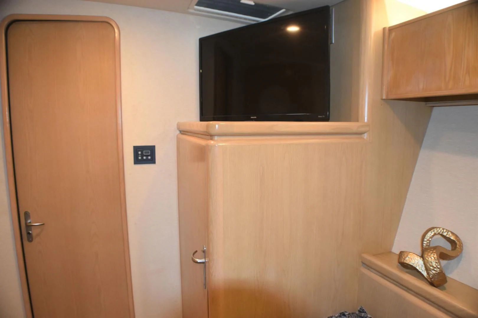 a door and a mirror in a room aboard JEWEL OF THE NILE Yacht for Sale