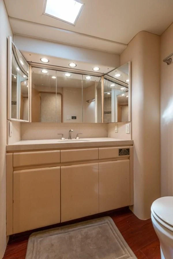 a bathroom with a large mirror aboard JEWEL OF THE NILE Yacht for Sale