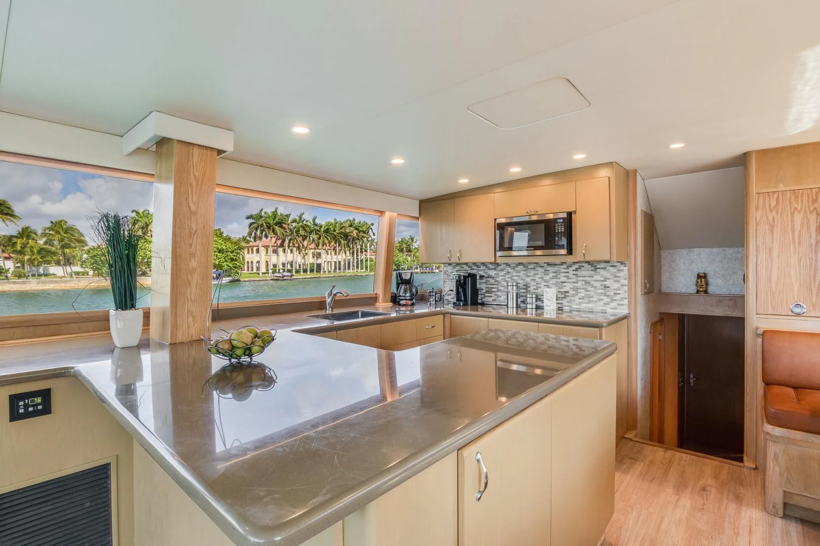 a kitchen with a large island aboard JEWEL OF THE NILE Yacht for Sale