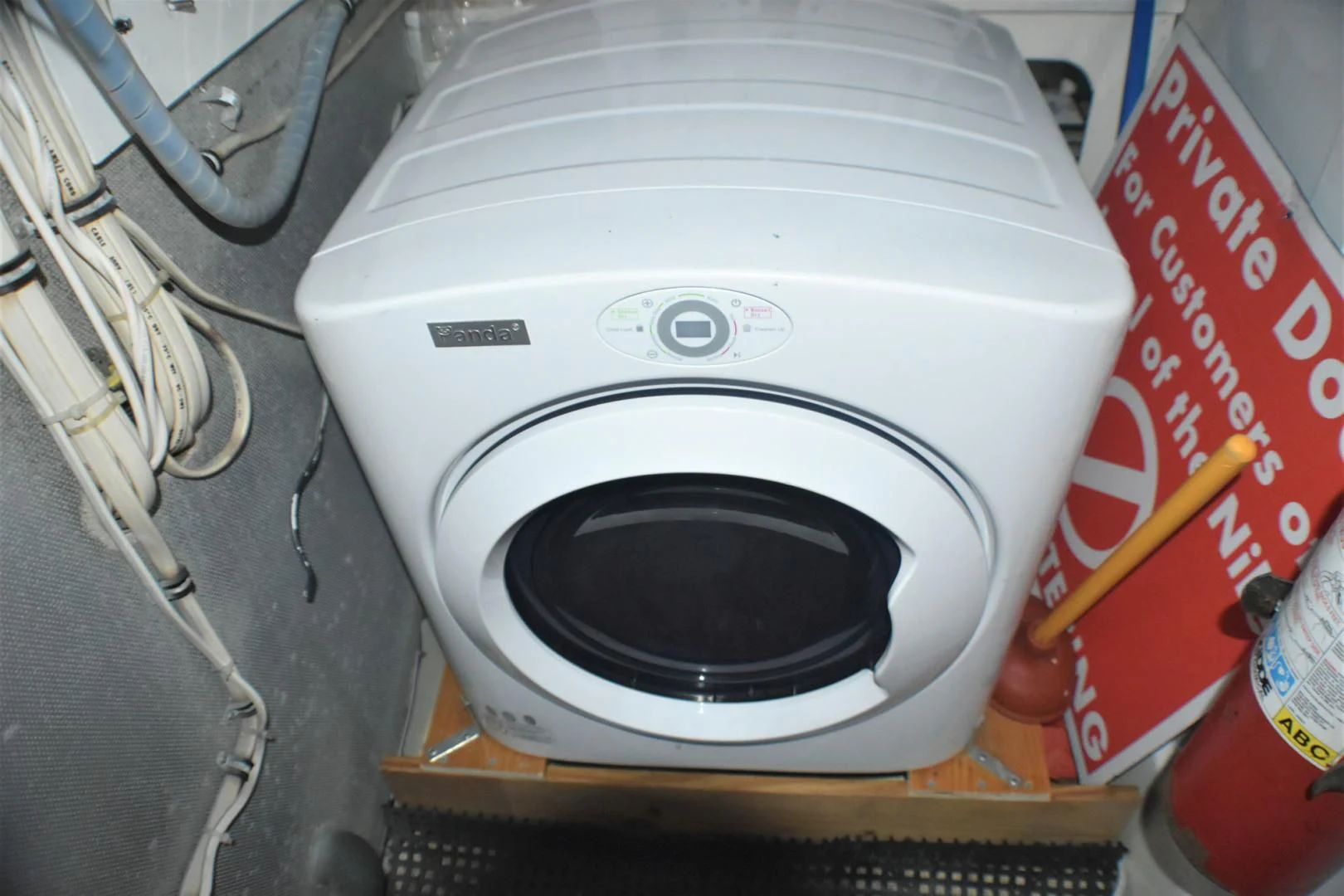 a toilet with a black seat aboard JEWEL OF THE NILE Yacht for Sale