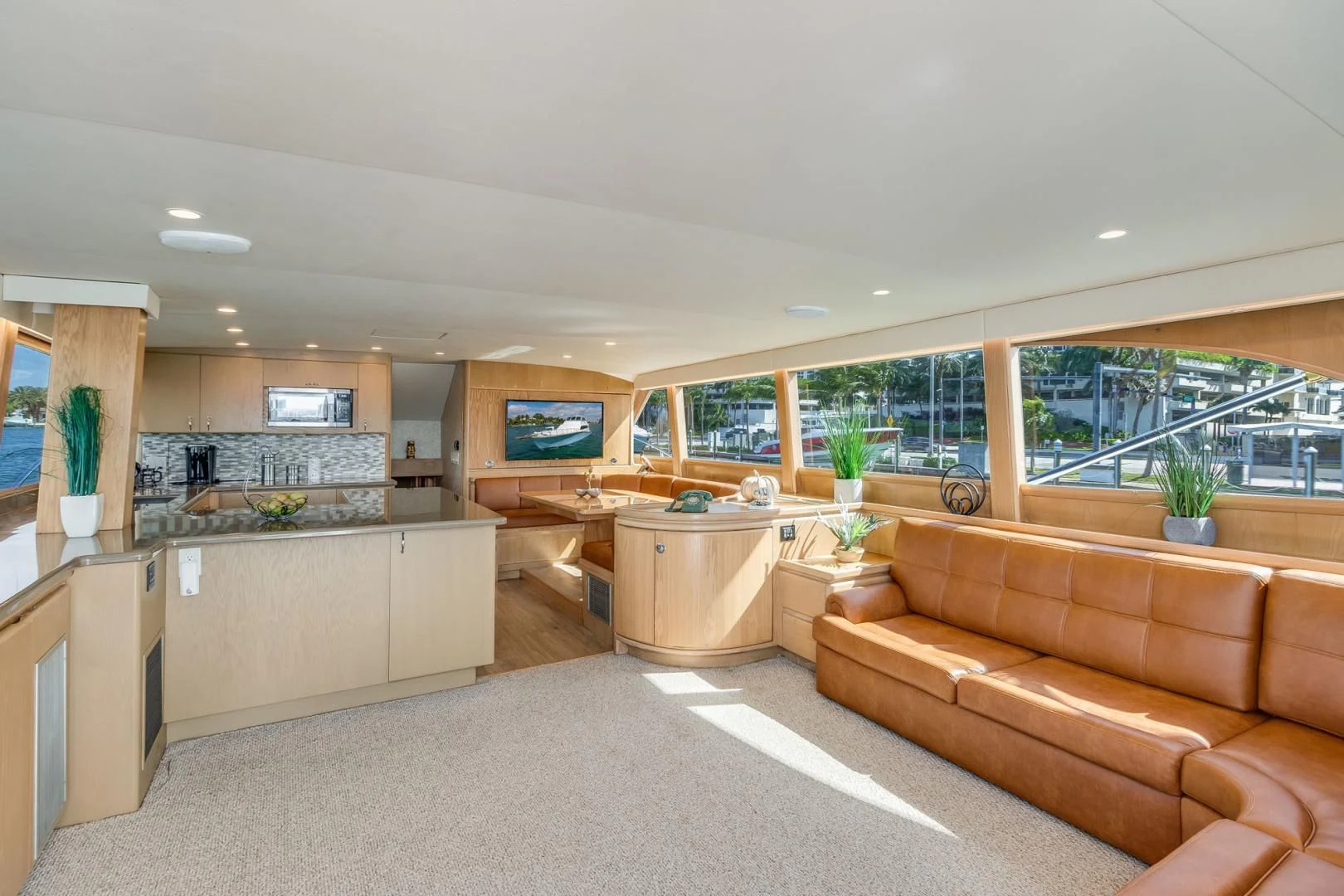 a living room with a couch and a tv aboard JEWEL OF THE NILE Yacht for Sale