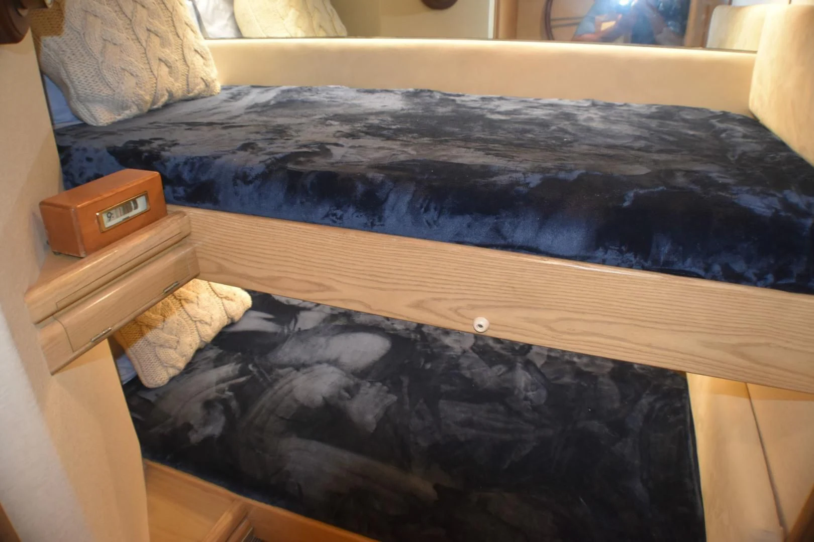 a bed with a blue blanket aboard JEWEL OF THE NILE Yacht for Sale